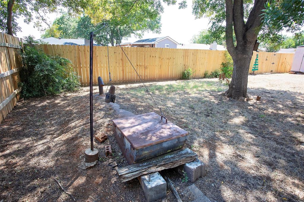 1202 Randy Drive Graham, TX 76450 - Photo 38 of 40 a view of a backyard with a tree