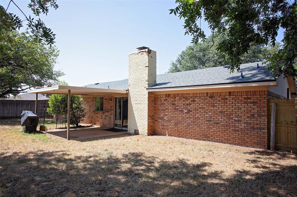 1202 Randy Drive Graham, TX 76450 - Photo 39 of 40 a view of a street with a tree in the background