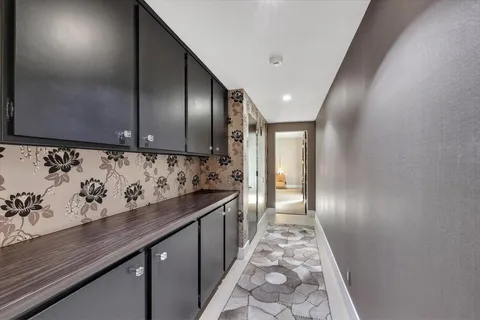 a view of hallway with wooden floor