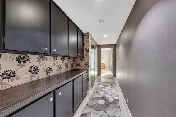 a view of hallway with wooden floor