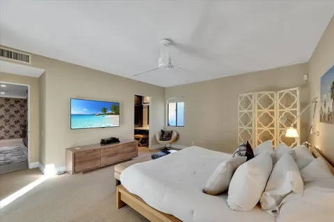 a bed room with two bed and a couch