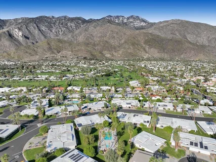 a view of a house with a mountain in the background