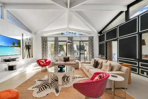 a view of a livingroom with furniture and window