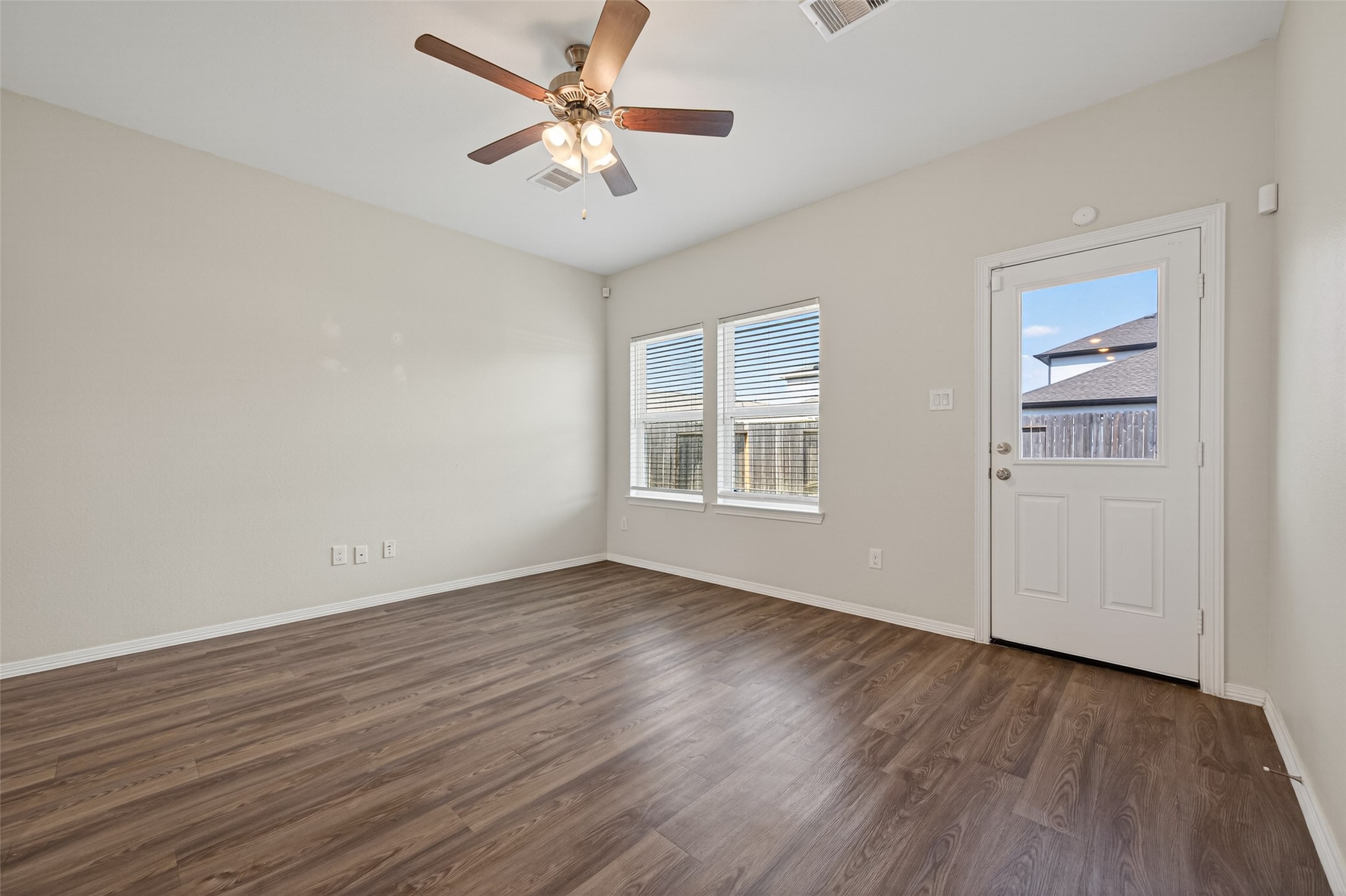 23222 Spring Genesis Lane Katy, TX 77493 - Photo 12 of 43 This inviting space features durable vinyl flooring, a ceiling fan for optimal cooling, and the convenience of direct access to the backyard.