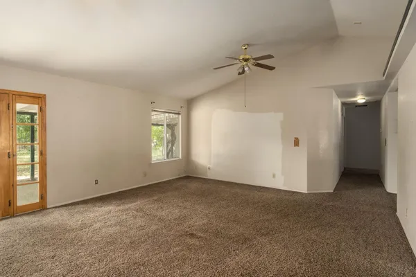 a view of an empty room with a window