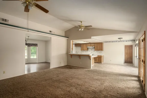 a view of a kitchen with a sink and a window