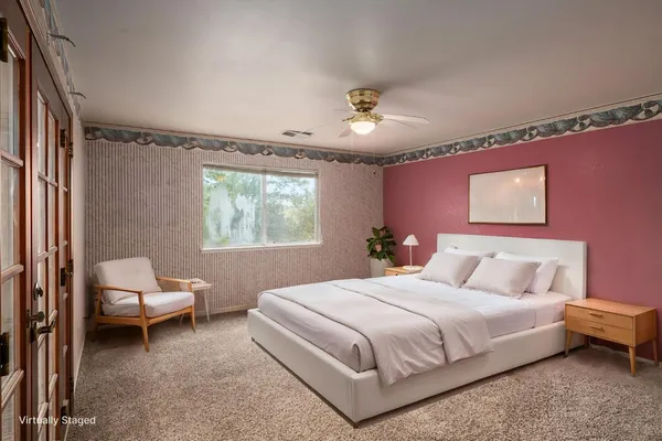 a view of an empty room with a fan