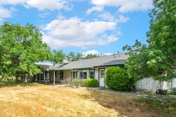 a view of a yard with an outdoor space