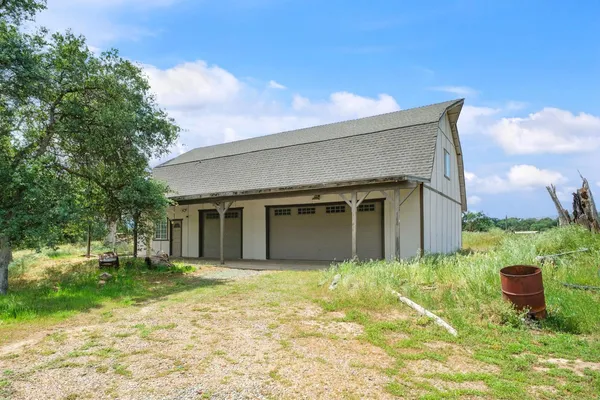 a view of a garage with a table and chairs