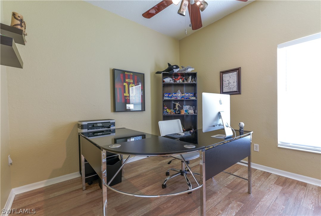 8249 Silver Birch Way Lehigh Acres, FL 33971 - Photo 17 of 19 a work room with furniture and a window