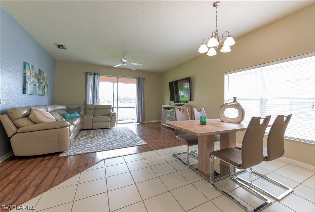 8249 Silver Birch Way Lehigh Acres, FL 33971 - Photo 7 of 19 a view of a dining room with furniture