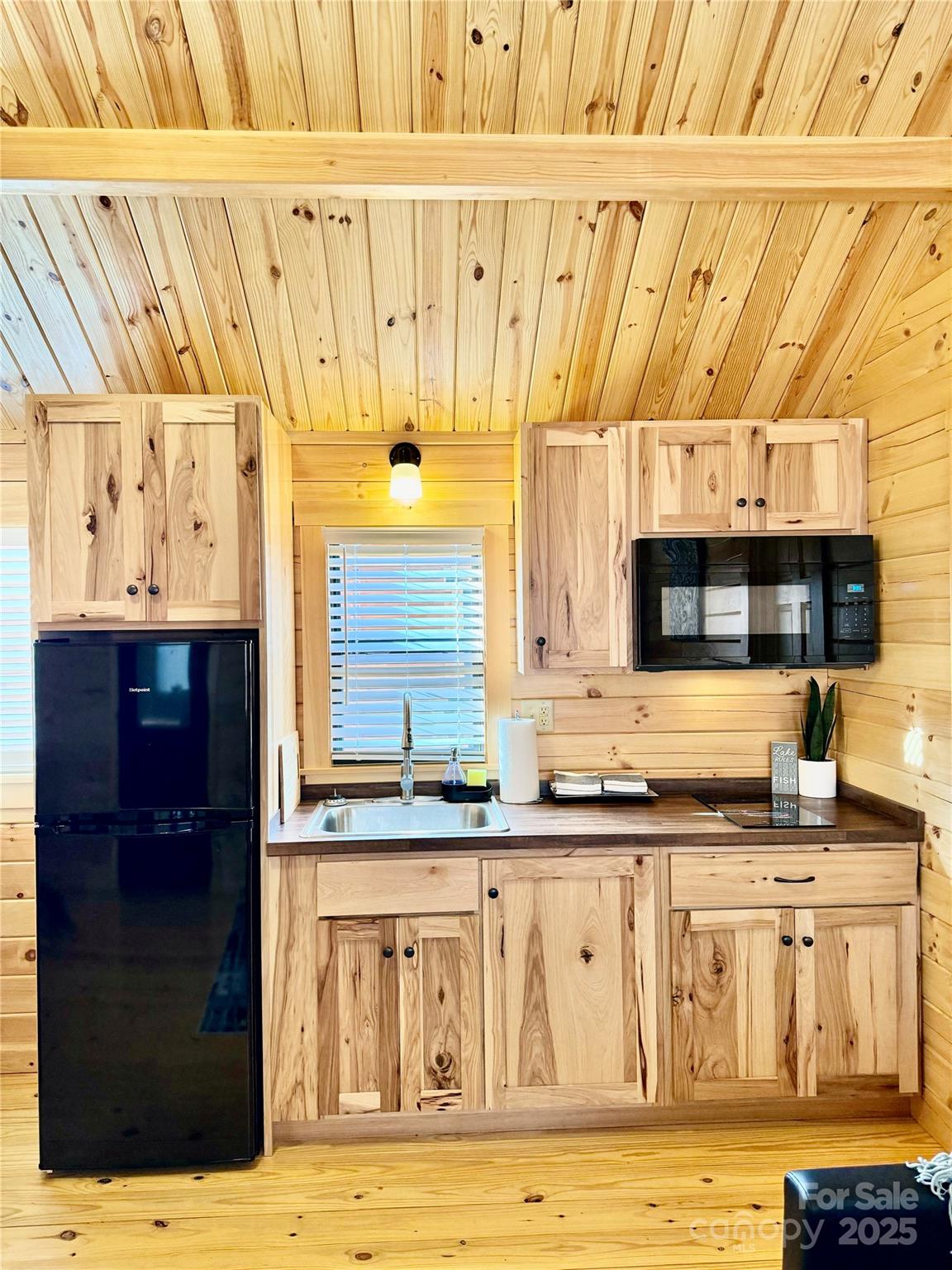 37 Bream Loop Marion, NC 28752 - Photo 12 of 22 a bathroom with a granite countertop sink and a large mirror