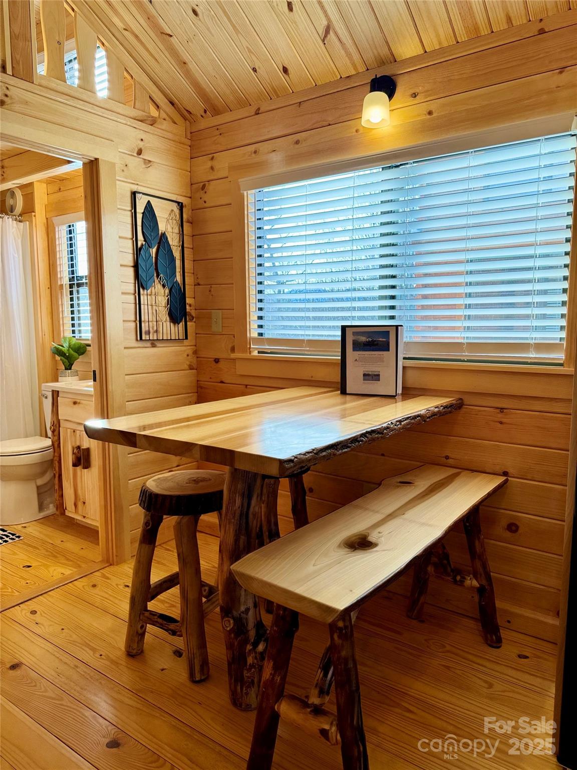37 Bream Loop Marion, NC 28752 - Photo 14 of 22 a view of a patio with table and chairs with wooden floor and fence