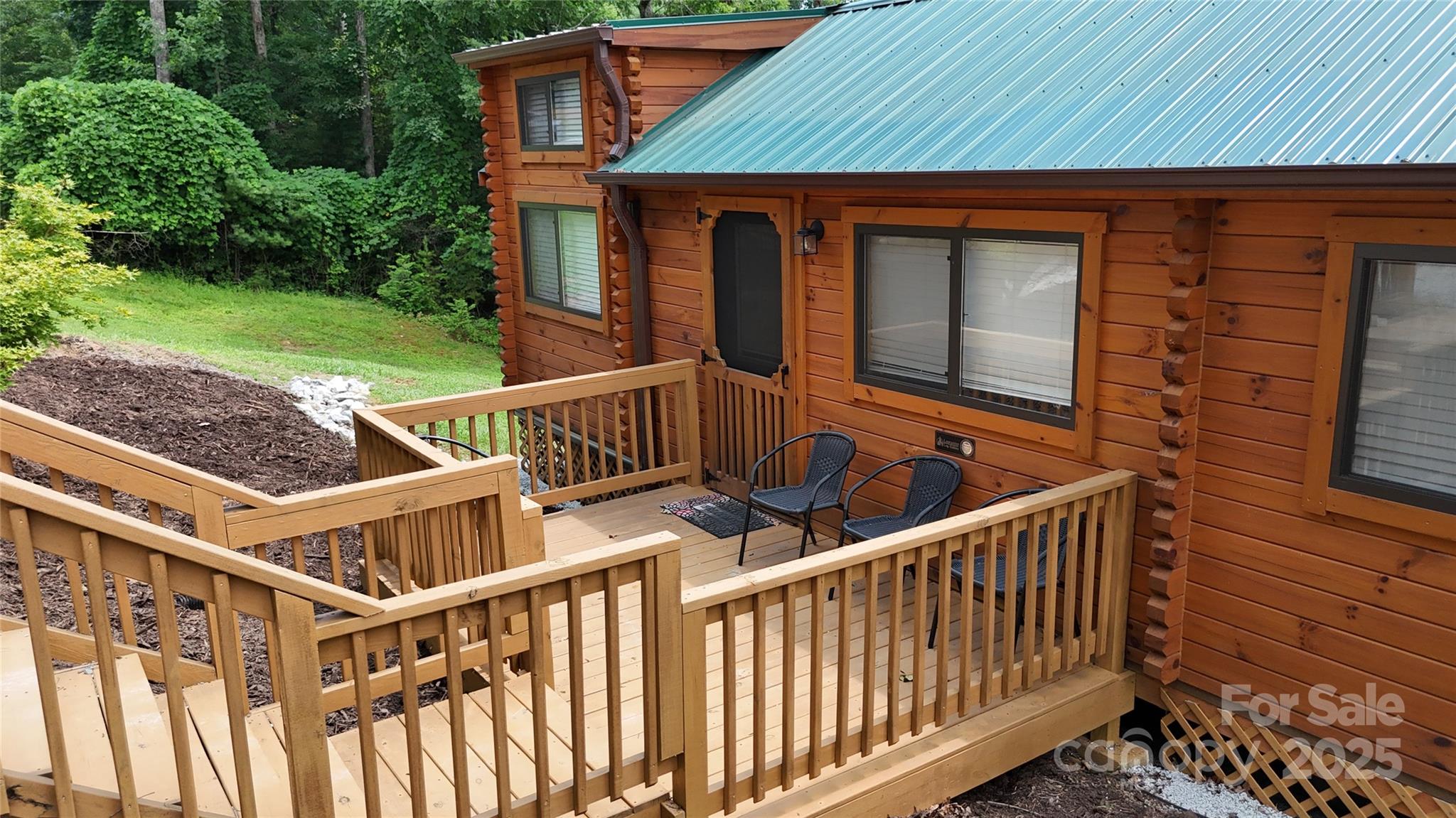 37 Bream Loop Marion, NC 28752 - Photo 6 of 22 a view of house with backyard and deck