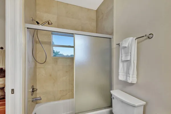 a bathroom with a shower and a toilet