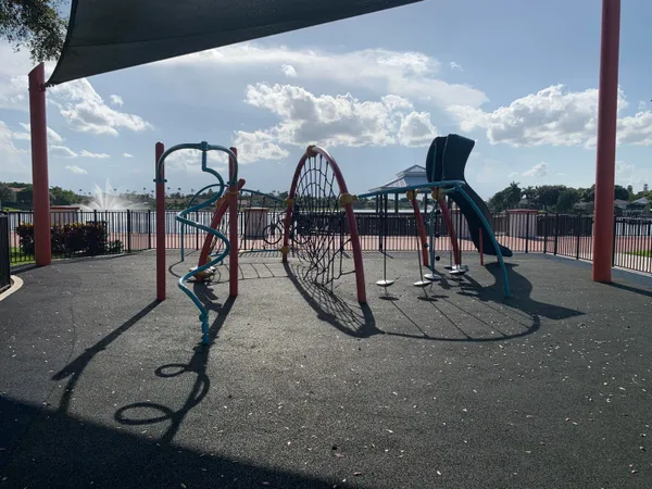 a couple of cars parked next to a road