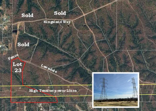 a street sign on a wall next to a road