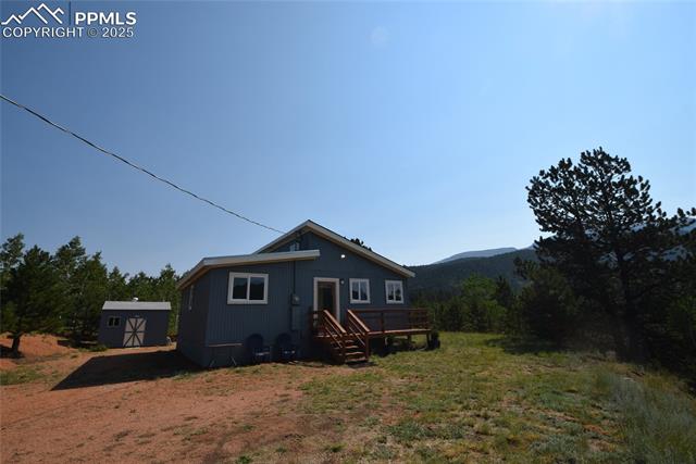 80 Spur Road Divide, CO 80814 - Photo 4 of 48 Rear view of property featuring a storage unit