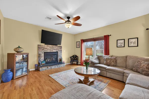 a living room with furniture fireplace and a flat screen tv