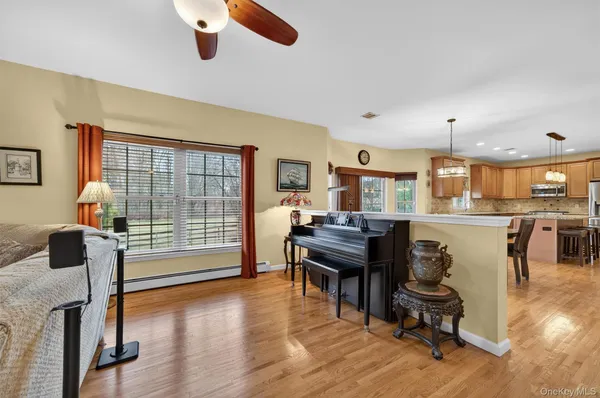 a large kitchen with a table and chairs