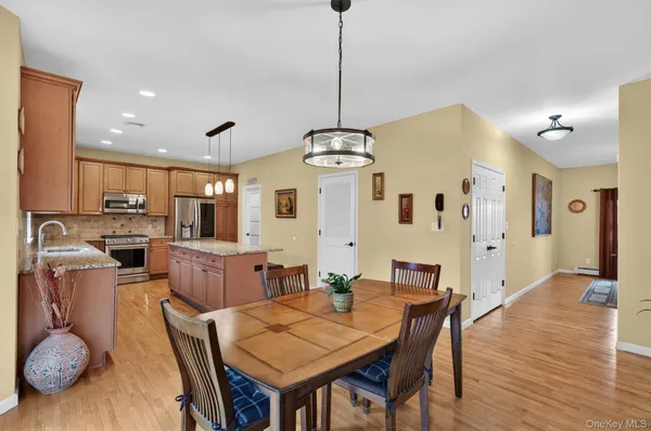 a kitchen with a stove a sink and a refrigerator