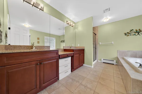 a bath tub sitting in a bathroom next to a window