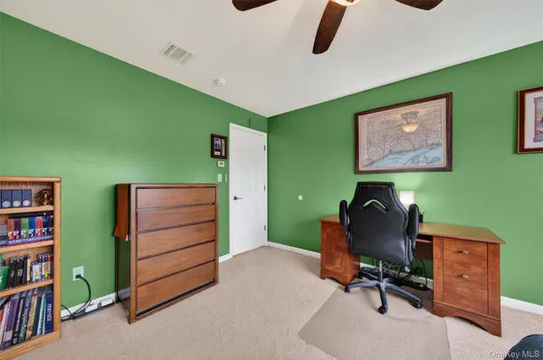 a bed room with furniture and window