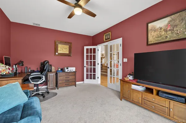 a dining room with furniture and window
