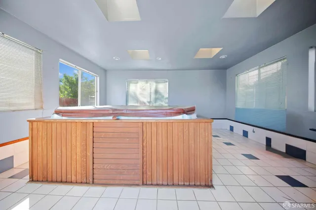 a bathroom with a sink a mirror and a bathtub