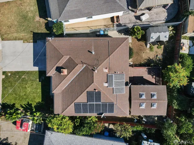 an aerial view of residential houses with outdoor space