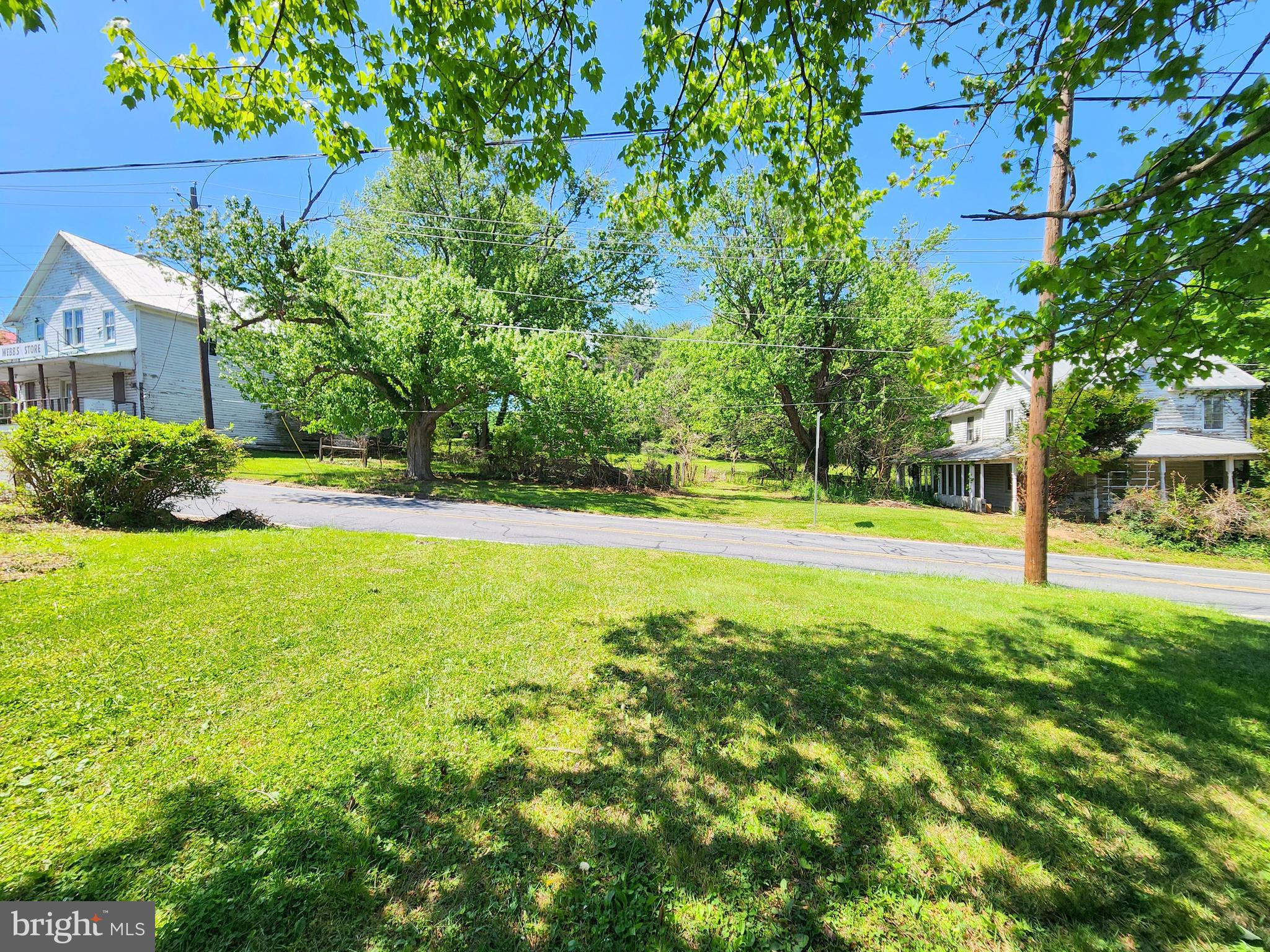 26506 Clarksburg Road Clarksburg, MD 20871 - Photo 38 of 39 a view of a house with a big yard and large trees