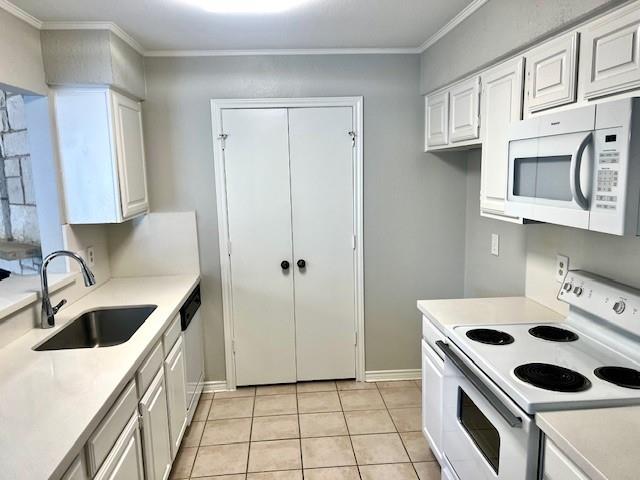 138 East Bethel School Road Coppell, TX 75019 - Photo 11 of 14 a kitchen with white cabinets a sink and a stove top oven