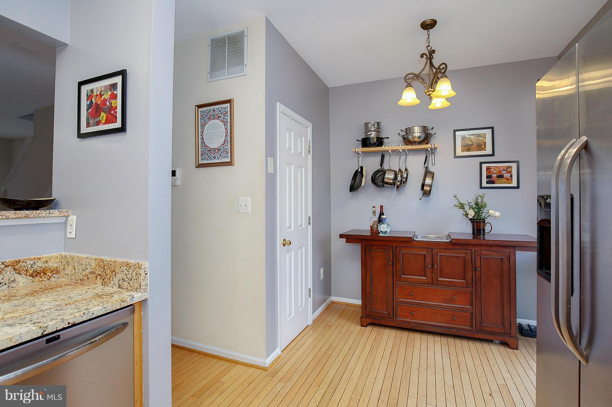 5806 Summers Grove Road Alexandria, VA 22304 - Photo 12 of 30 a view of hallway with wooden floor and furniture