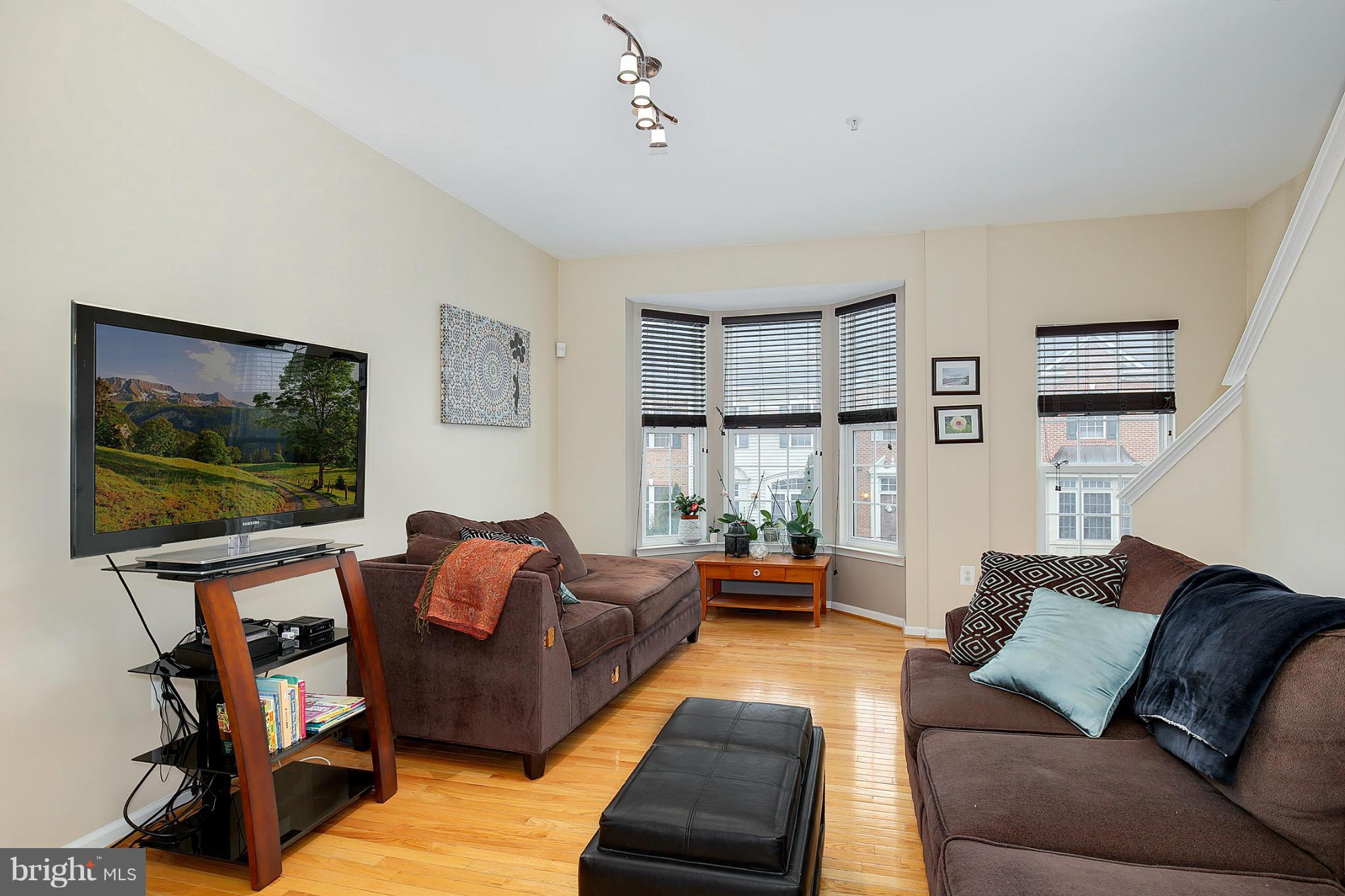 5806 Summers Grove Road Alexandria, VA 22304 - Photo 15 of 30 a living room with furniture and a flat screen tv