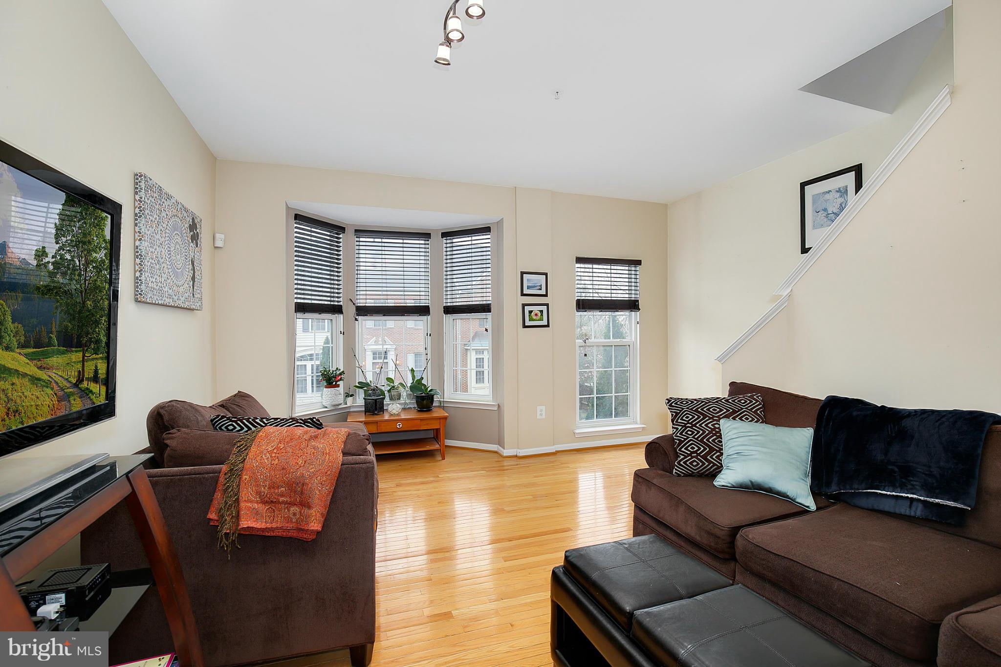 5806 Summers Grove Road Alexandria, VA 22304 - Photo 16 of 30 a living room with furniture and a flat screen tv