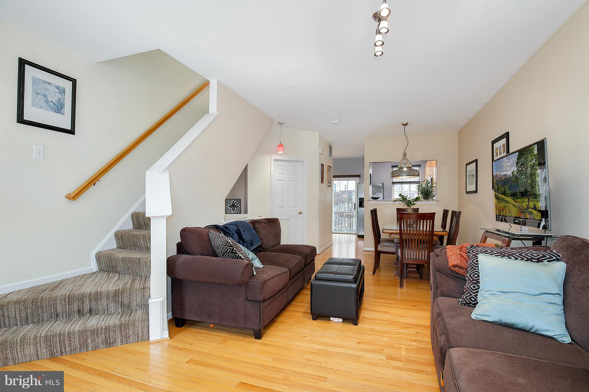 5806 Summers Grove Road Alexandria, VA 22304 - Photo 17 of 30 a living room with furniture and a flat screen tv