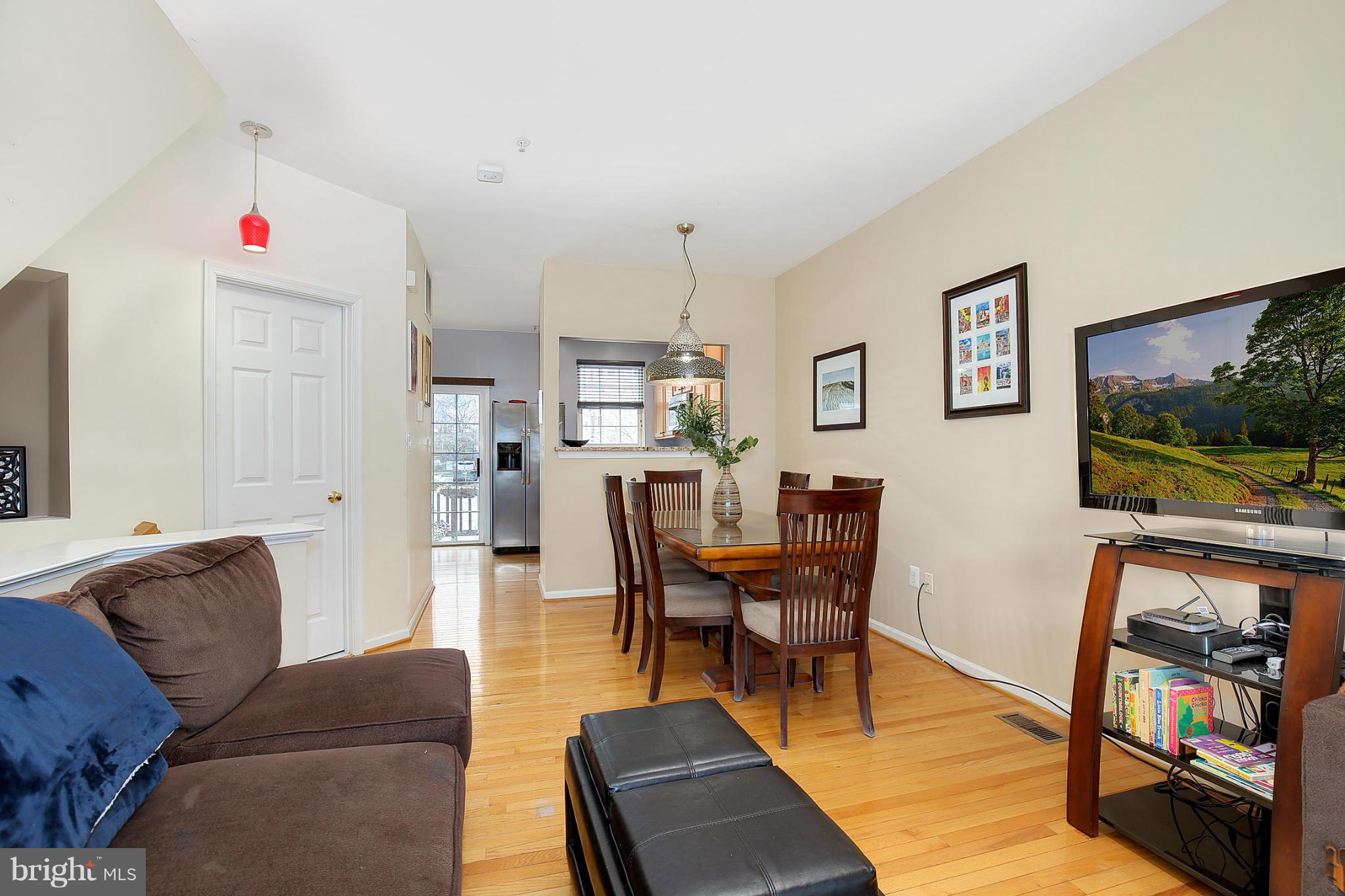5806 Summers Grove Road Alexandria, VA 22304 - Photo 18 of 30 a living room with furniture and a flat screen tv