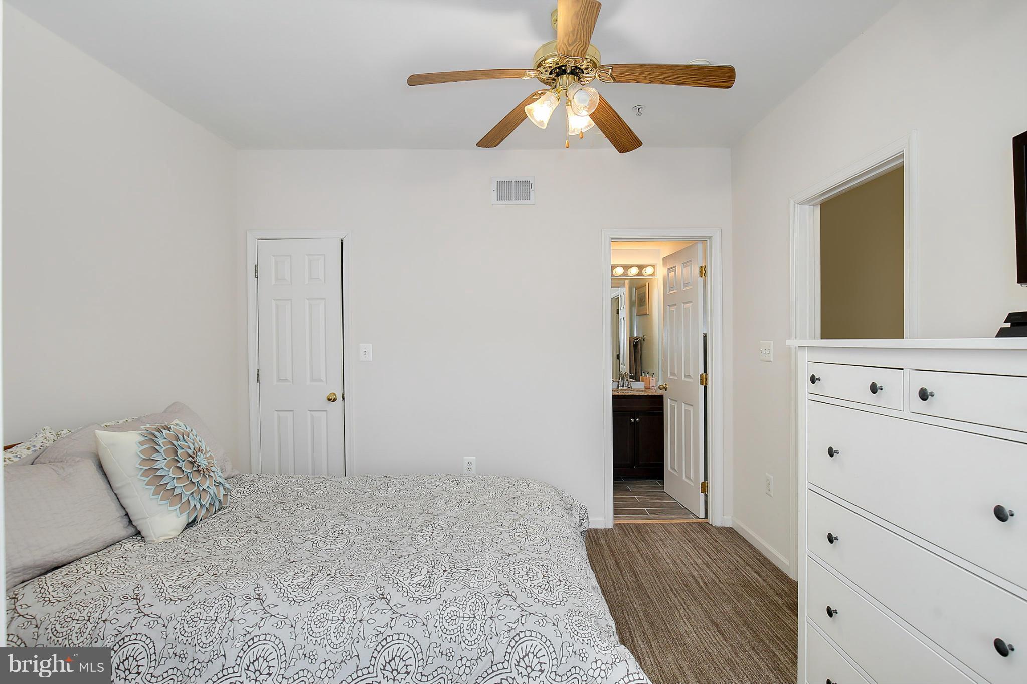 5806 Summers Grove Road Alexandria, VA 22304 - Photo 26 of 30 a bedroom with a bed and a dresser