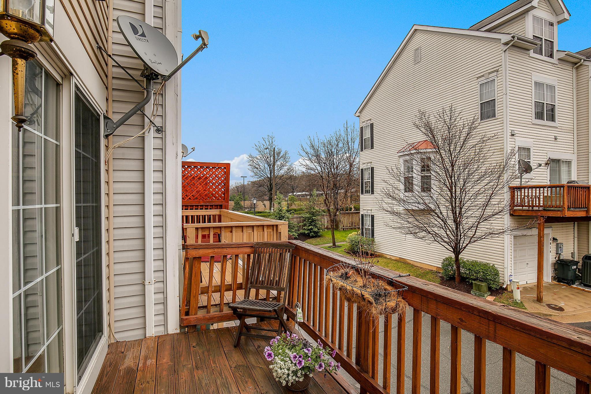 5806 Summers Grove Road Alexandria, VA 22304 - Photo 28 of 30 a view of a house with a small yard and furniture