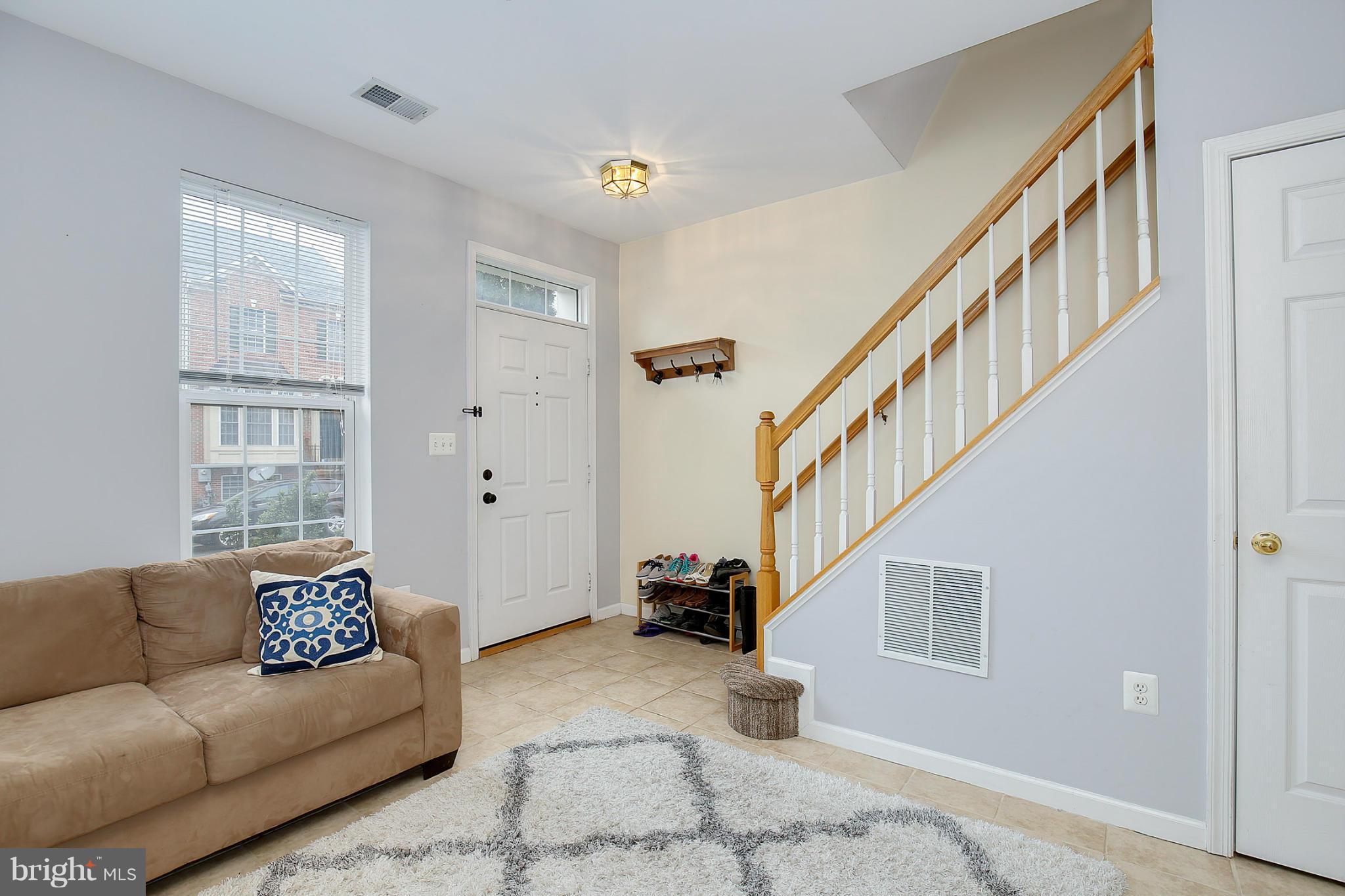 5806 Summers Grove Road Alexandria, VA 22304 - Photo 5 of 30 a living room with furniture and a window