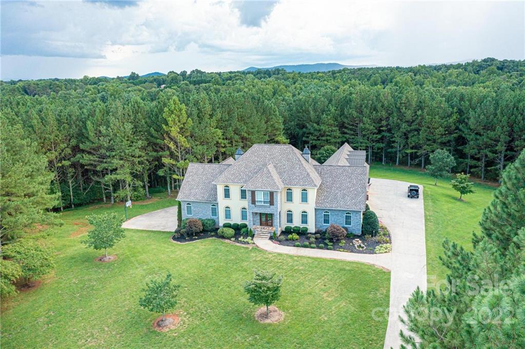 4597 Hickory Nut Ridge Road Granite Falls, NC 28630 - Photo 1 of 48 a aerial view of a house with big yard plants and large trees
