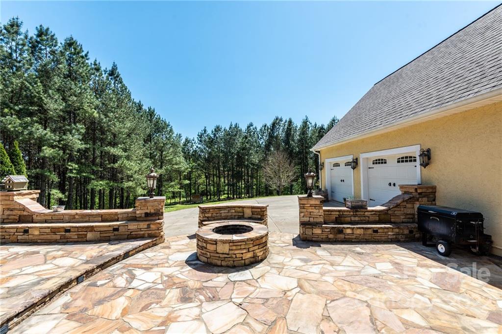 4597 Hickory Nut Ridge Road Granite Falls, NC 28630 - Photo 14 of 48 a view of backyard with trees and cars