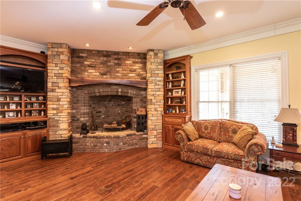 4597 Hickory Nut Ridge Road Granite Falls, NC 28630 - Photo 18 of 48 a living room with furniture and a fireplace
