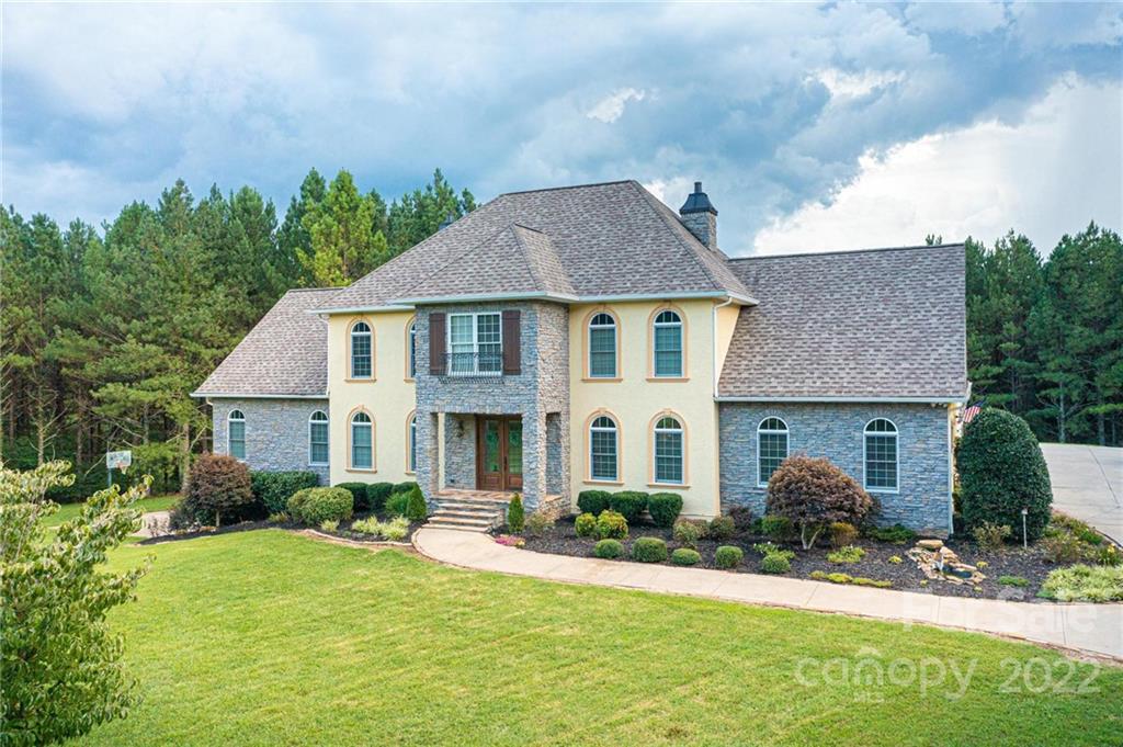 4597 Hickory Nut Ridge Road Granite Falls, NC 28630 - Photo 2 of 48 a front view of a house with a yard