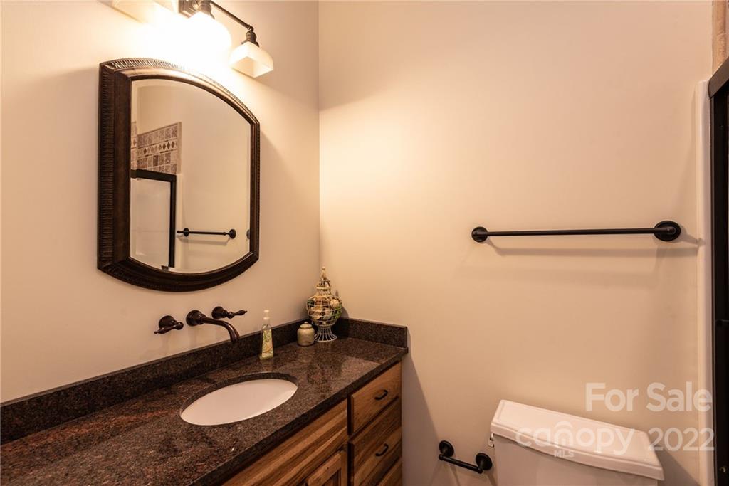 4597 Hickory Nut Ridge Road Granite Falls, NC 28630 - Photo 28 of 48 a bathroom with a sink and a mirror