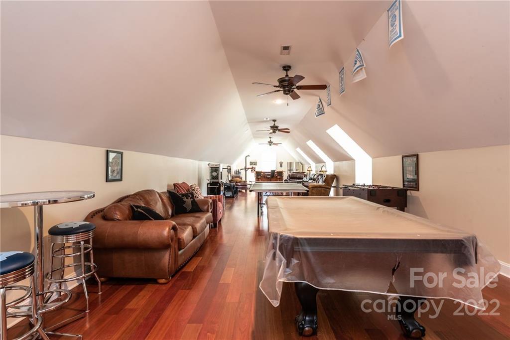 4597 Hickory Nut Ridge Road Granite Falls, NC 28630 - Photo 39 of 48 a living room with furniture and wooden floor