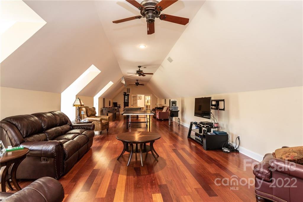 4597 Hickory Nut Ridge Road Granite Falls, NC 28630 - Photo 41 of 48 a living room with furniture and wooden floor