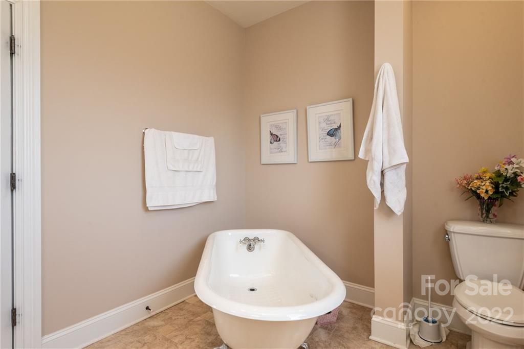 4597 Hickory Nut Ridge Road Granite Falls, NC 28630 - Photo 43 of 48 a bathroom with a sink and a toilet