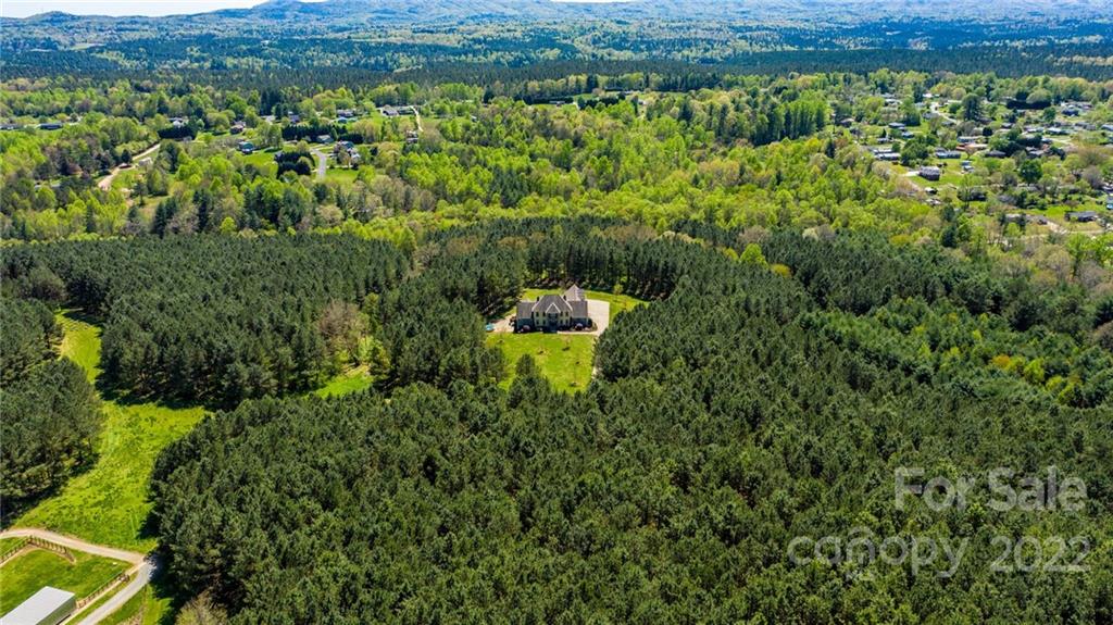 4597 Hickory Nut Ridge Road Granite Falls, NC 28630 - Photo 47 of 48 a view of a lush green field