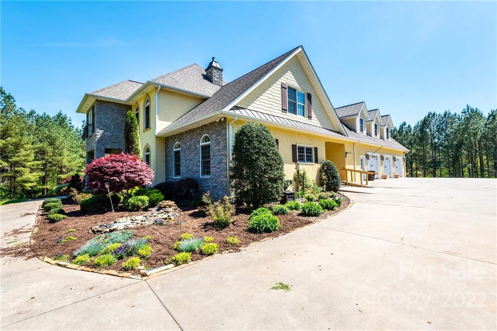 4597 Hickory Nut Ridge Road Granite Falls, NC 28630 - Photo 5 of 48 a front view of a house with a yard